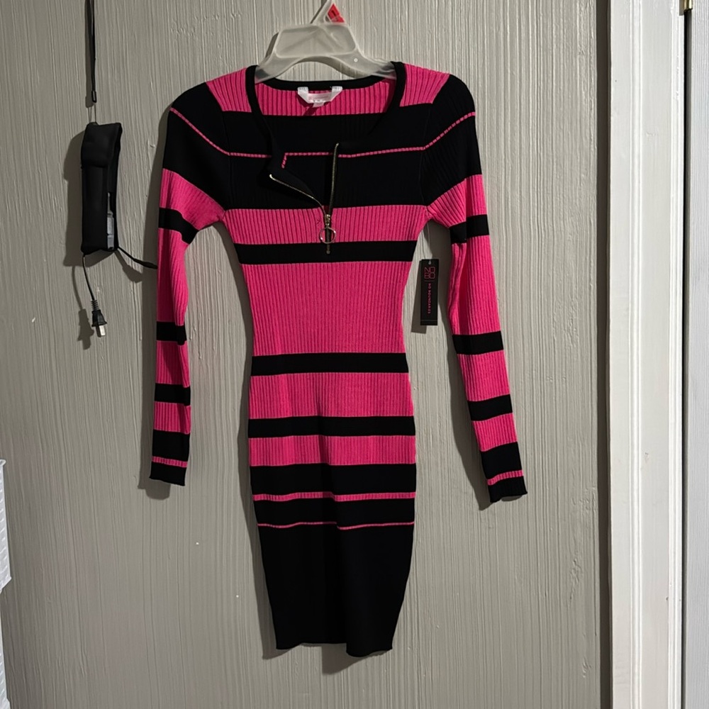 Pink suit with black lines round neck